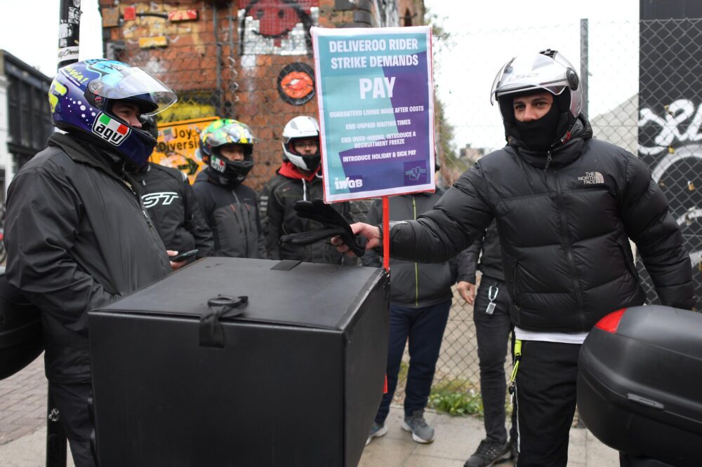 Deliveroo riders from the Independent Workers’ Union of Great Britain in Shoreditch High Street, east London, as they go on strike