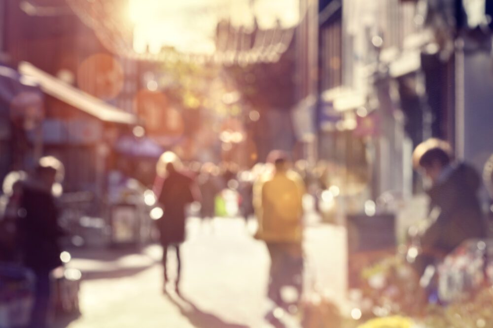 crowd of shoppers walking and shopping on a high s PMP3CPA 1