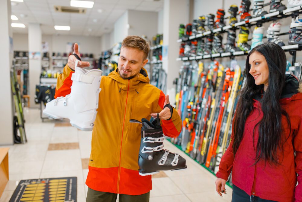 couple choosing ski boots shopping sports shop 2021 04 02 20 17 17 utc